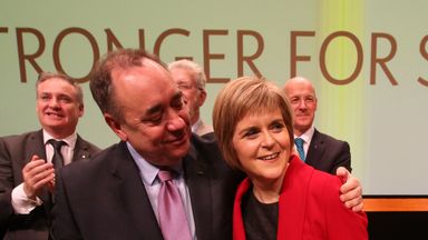 Former SNP leader Alex Salmond gives new leader Nicola Sturgeon a hug after her speech at the annual SNP party conference at Perth Concert Hall, Scotland.